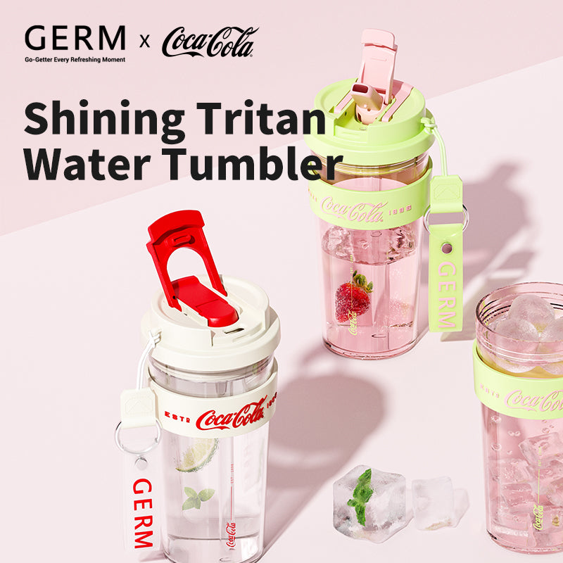 Three GERM x Coca-Cola water tumblers on a light pink background