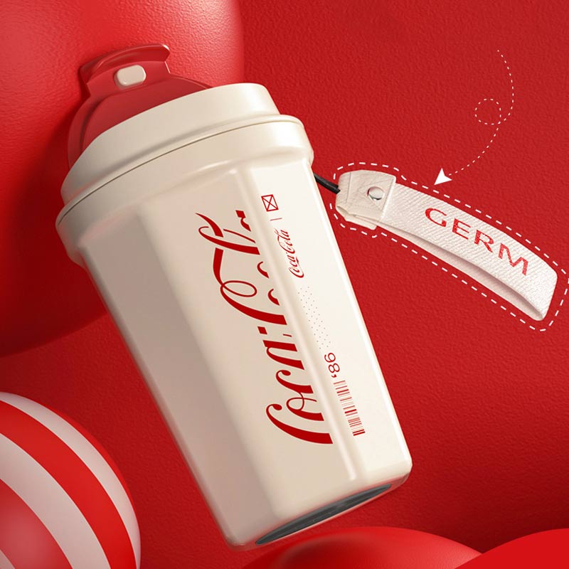 Coca-Cola branded container with a 'GERM' tag on a red background