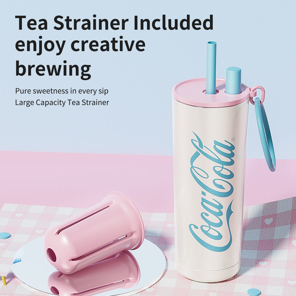 Coca-Cola tumbler with tea strainer on a checkered tablecloth