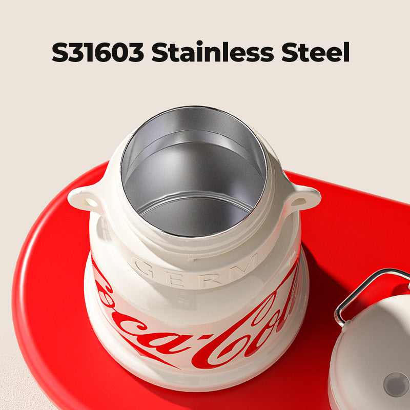 Stainless steel container with Coca-Cola branding on a red base