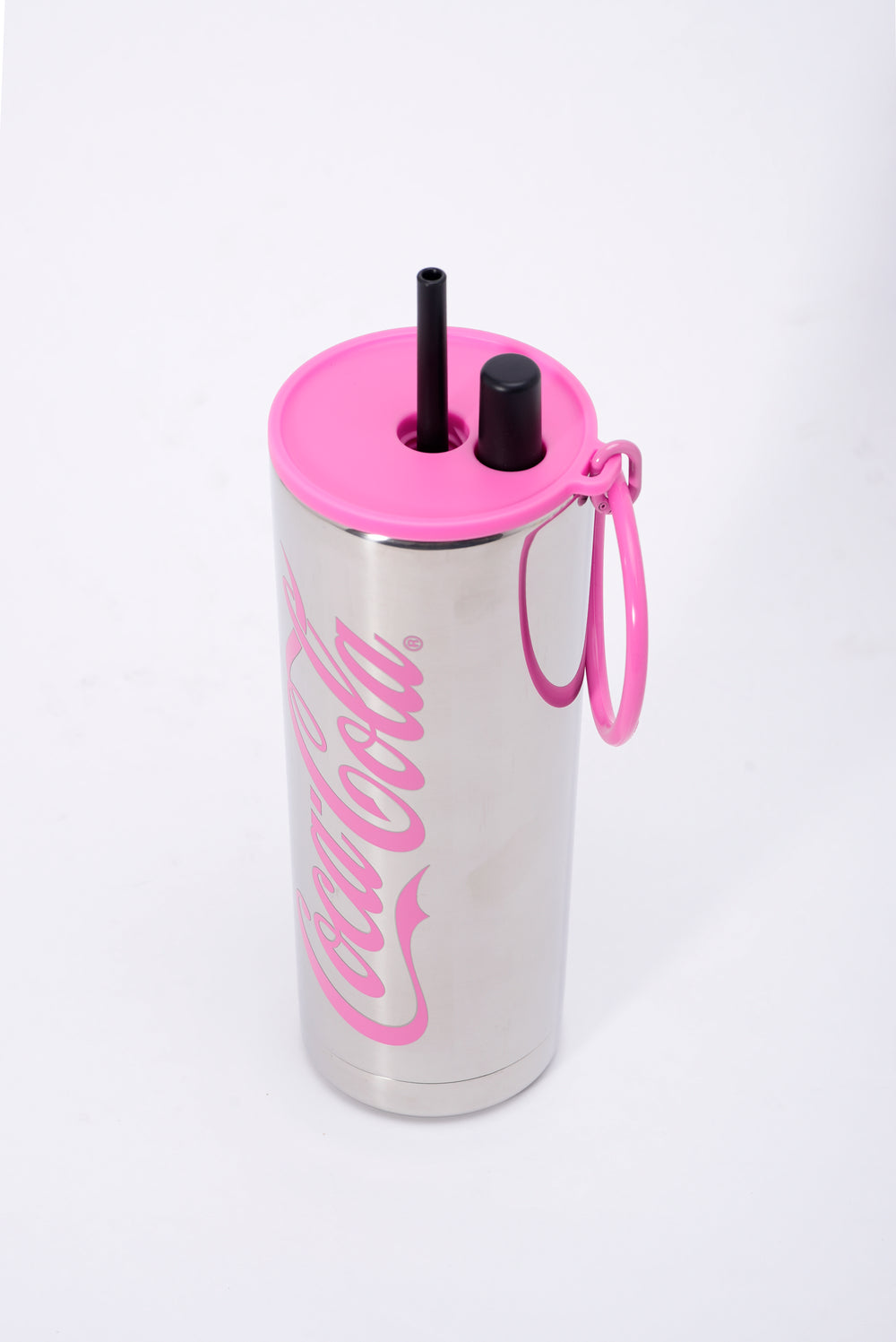 Stainless steel tumbler with pink lid and straw on a white background